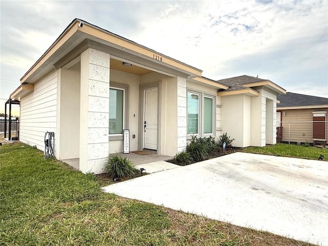 property entrance with a yard