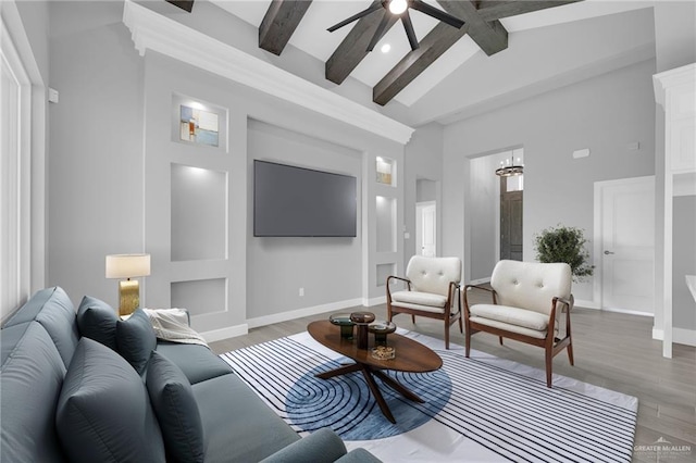 1104 Azalea Ave, Mission, TX 78573 - living area with beamed ceiling, light wood finished floors, ceiling fan, high vaulted ceiling, and baseboards