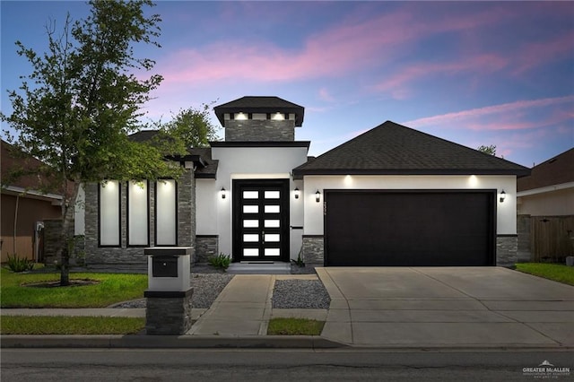 view of front facade with stone siding, an attached garage, stucco siding, roof with shingles, and driveway