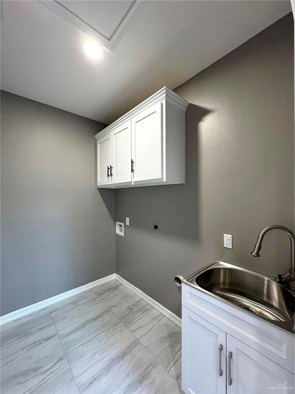 laundry area featuring sink, hookup for a washing machine, electric dryer hookup, and cabinets