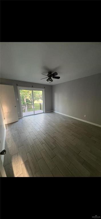 2201 S Jackson Rd Unit J11, Pharr, TX 78577 - empty room with baseboards, a ceiling fan, and wood finished floors