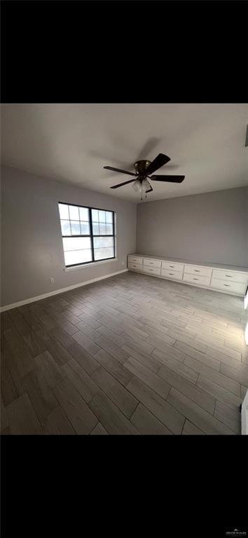 2201 S Jackson Rd Unit J11, Pharr, TX 78577 - spare room with wood finished floors, visible vents, a ceiling fan, and baseboards
