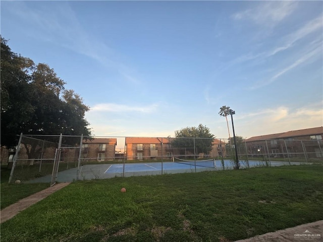 2201 S Jackson Rd Unit J11, Pharr, TX 78577 - view of tennis court featuring fence and a yard