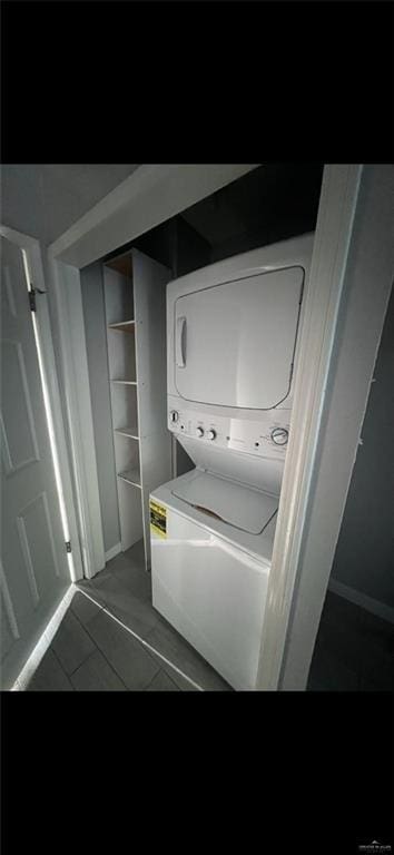 2201 S Jackson Rd Unit J11, Pharr, TX 78577 - clothes washing area with stacked washer / dryer and laundry area