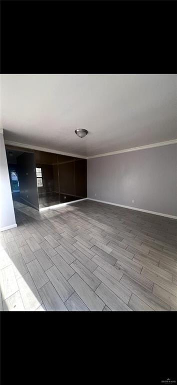 2201 S Jackson Rd Unit J11, Pharr, TX 78577 - empty room with wood tiled floor, crown molding, and baseboards
