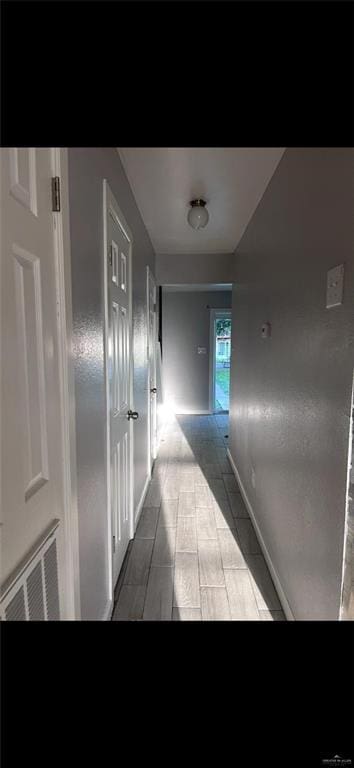 2201 S Jackson Rd Unit J11, Pharr, TX 78577 - corridor featuring baseboards and visible vents