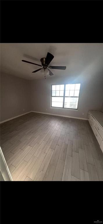 2201 S Jackson Rd Unit J11, Pharr, TX 78577 - spare room with light wood-style flooring, baseboards, and ceiling fan