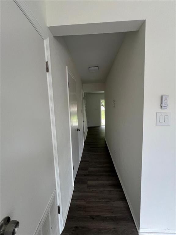 2201 S Jackson Rd Unit J11, Pharr, TX 78577 - hallway featuring dark wood-type flooring, visible vents, and baseboards