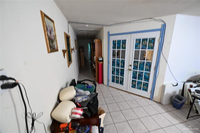 interior space featuring french doors and light tile patterned floors