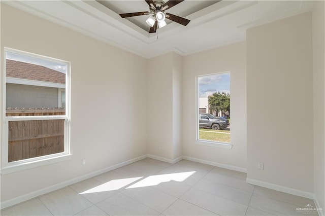 tiled empty room featuring ceiling fan