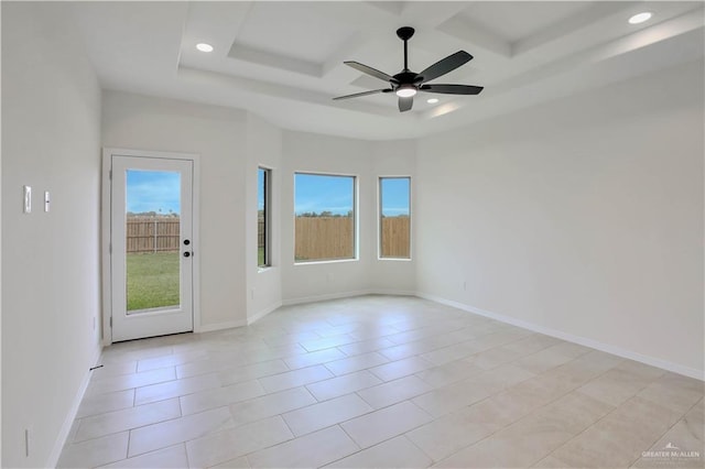 1502 Stirrup Cir, San Benito, TX 78586 - empty room featuring a ceiling fan, recessed lighting, coffered ceiling, light tile patterned floors, and baseboards