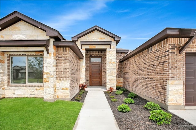 1502 Stirrup Cir, San Benito, TX 78586 - entrance to property featuring brick siding, stone siding, and a yard