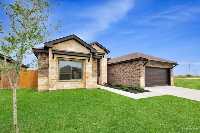 1502 Stirrup Cir, San Benito, TX 78586 - single story home with stone siding, concrete driveway, an attached garage, and brick siding