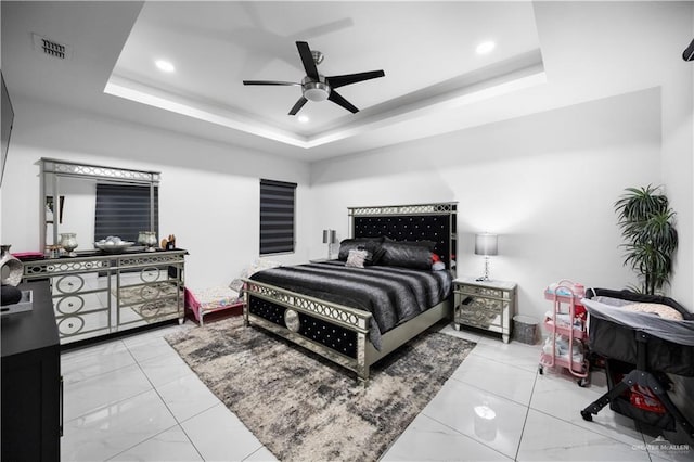 1613 E Mayhem Dr, Edinburg, TX 78542 - bedroom featuring marble look tiles, a raised ceiling, recessed lighting, and a ceiling fan