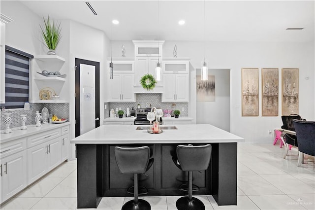 1613 E Mayhem Dr, Edinburg, TX 78542 - kitchen with open shelves, light countertops, backsplash, and recessed lighting