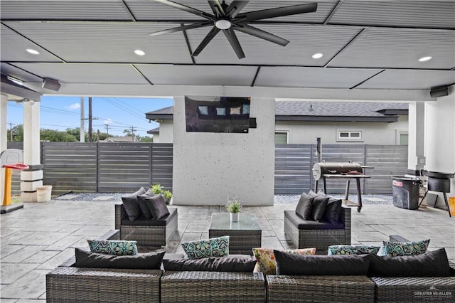 1613 E Mayhem Dr, Edinburg, TX 78542 - fenced backyard with outdoor lounge area, a ceiling fan, and a patio area