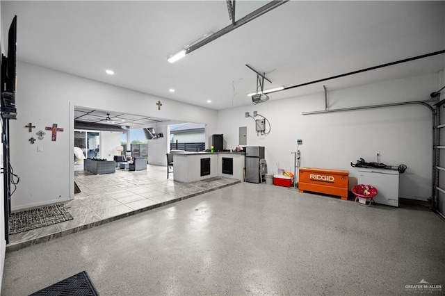 1613 E Mayhem Dr, Edinburg, TX 78542 - garage featuring a garage door opener, recessed lighting, and electric panel