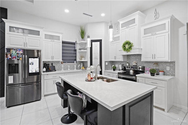 1613 E Mayhem Dr, Edinburg, TX 78542 - kitchen with stainless steel appliances, a sink, light marble finish floors, light countertops, and a kitchen island with sink