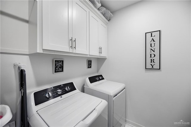 1613 E Mayhem Dr, Edinburg, TX 78542 - laundry room with cabinet space, washing machine and clothes dryer, and baseboards