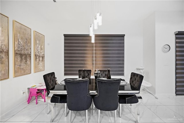 1613 E Mayhem Dr, Edinburg, TX 78542 - dining area featuring marble finish floors and baseboards
