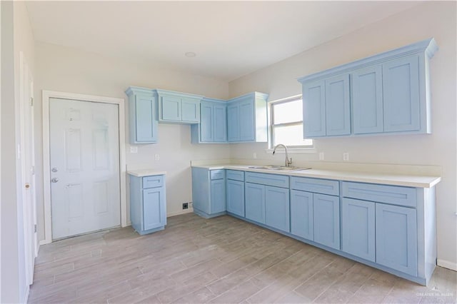 kitchen featuring sink and light hardwood / wood-style flooring