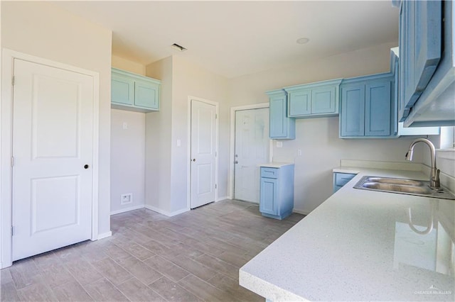 kitchen with sink and light wood-type flooring