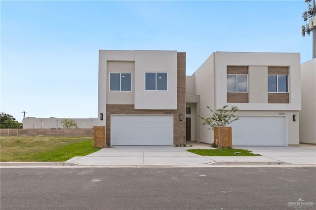 1214 N Lincoln Ave, San Juan, TX 78589 - contemporary home with a garage, concrete driveway, and stucco siding