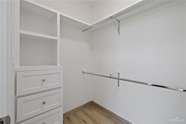 1214 N Lincoln Ave, San Juan, TX 78589 - spacious closet with light wood finished floors
