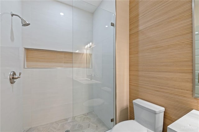 1214 N Lincoln Ave, San Juan, TX 78589 - full bathroom featuring toilet, a stall shower, vanity, and tile walls