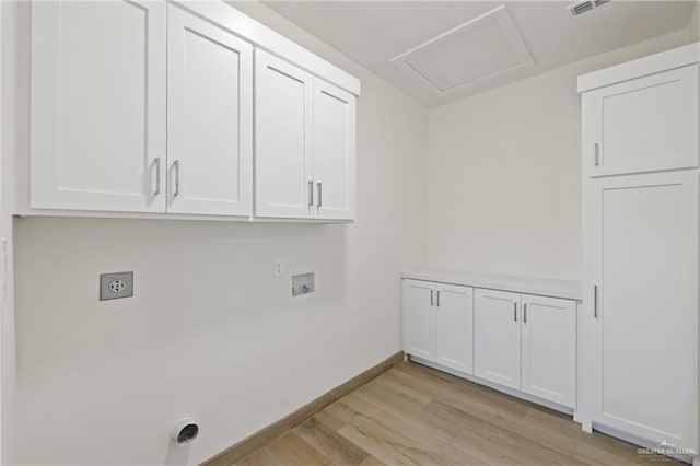 1214 N Lincoln Ave, San Juan, TX 78589 - washroom with electric dryer hookup, cabinet space, washer hookup, light wood-style floors, and baseboards