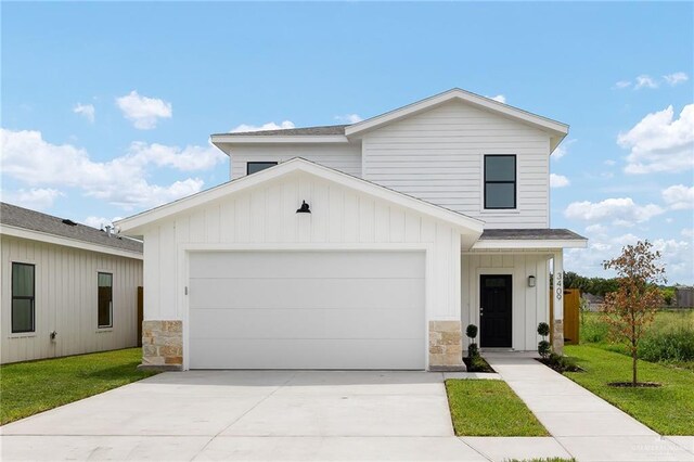 3409 Emma Dr, Weslaco, TX 78596 - modern farmhouse featuring stone siding, driveway, a front yard, and board and batten siding