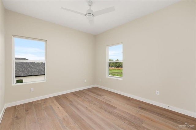 3409 Emma Dr, Weslaco, TX 78596 - spare room featuring baseboards and light wood-style flooring