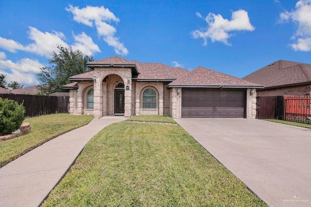 3908 Hill Crest Dr, Mission, TX 78573 - view of front facade with brick siding, a garage, concrete driveway, and roof with shingles