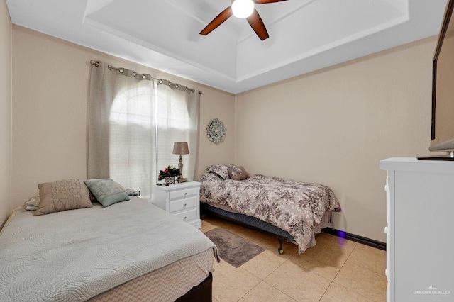 3908 Hill Crest Dr, Mission, TX 78573 - bedroom featuring a raised ceiling, light tile patterned flooring, and ceiling fan