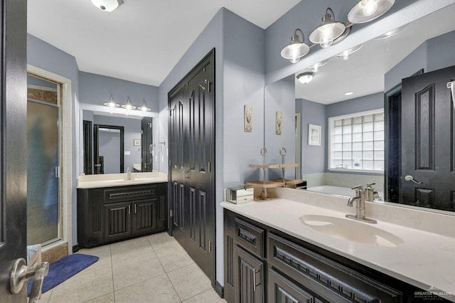 3908 Hill Crest Dr, Mission, TX 78573 - bathroom featuring a shower stall, vanity, and tile patterned floors