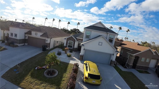 view of front of home featuring a garage and a front yard