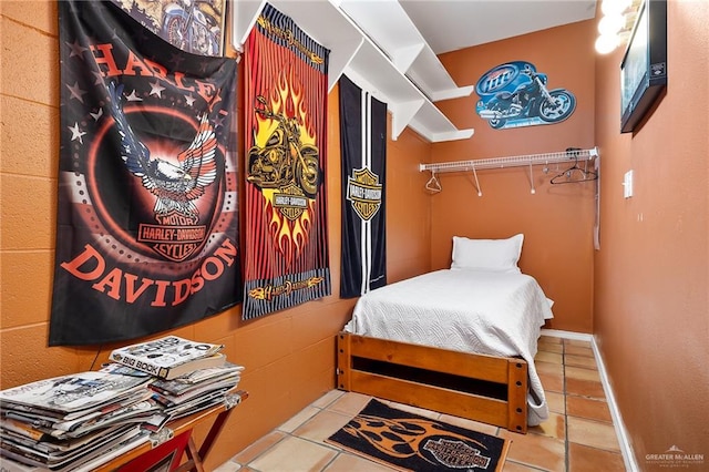 bedroom featuring light tile patterned floors