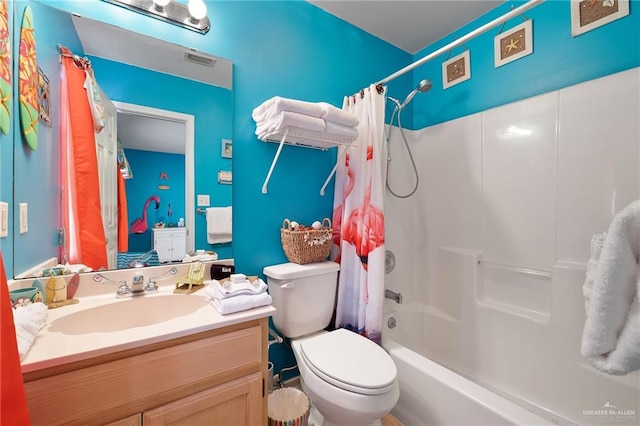 full bathroom featuring vanity, toilet, and shower / bath combo with shower curtain