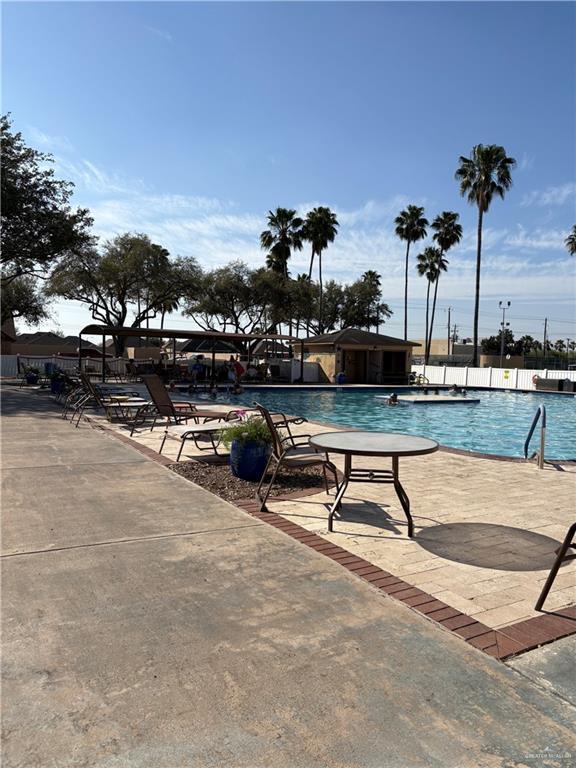 community pool with a patio