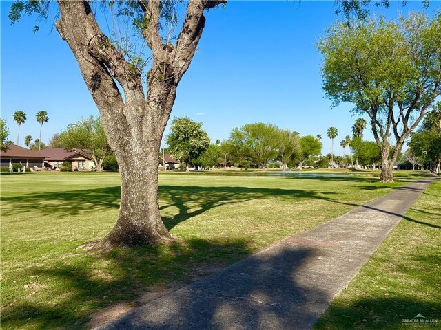 surrounding community featuring a yard