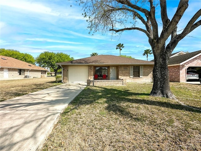 ranch-style house with a front yard, brick siding, a garage, and driveway