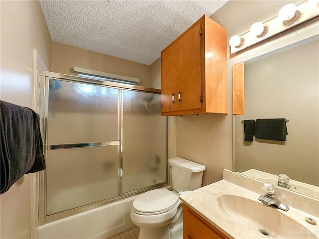 full bath featuring enclosed tub / shower combo, a textured ceiling, vanity, and toilet