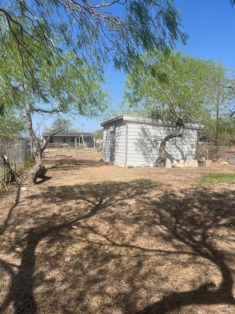 1151 S Texas Ave, Mercedes, TX 78570 - view of yard with fence