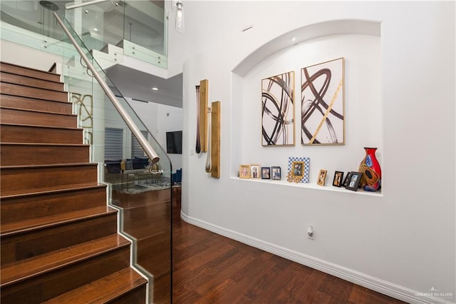 stairway with hardwood / wood-style flooring