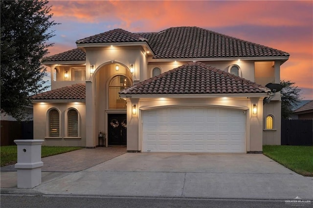 mediterranean / spanish-style home featuring a garage