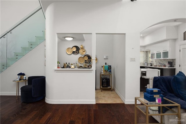 living room with dark hardwood / wood-style flooring