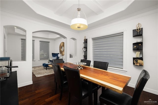 dining area featuring beamed ceiling, dark hardwood / wood-style floors, and ornamental molding