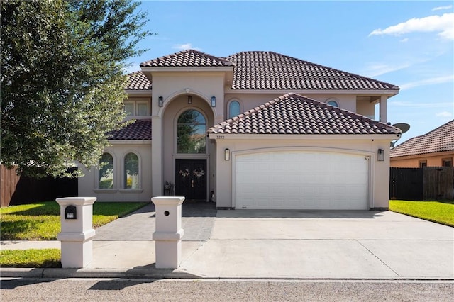 mediterranean / spanish house with a garage