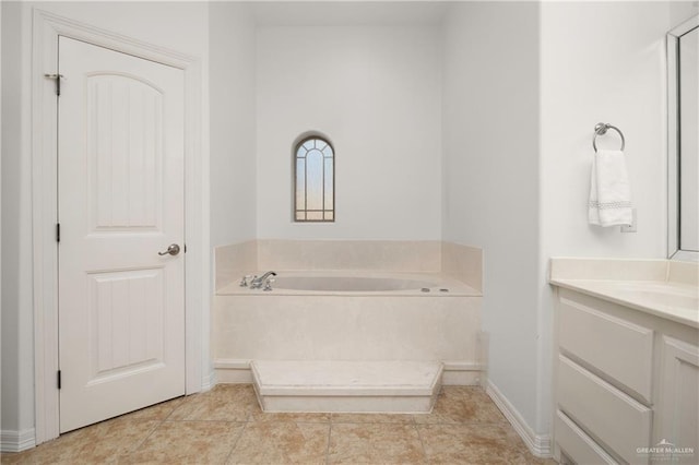 bathroom with vanity, a tub to relax in, and tile patterned floors