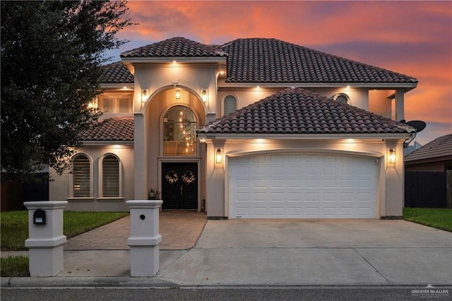 mediterranean / spanish-style home featuring a garage